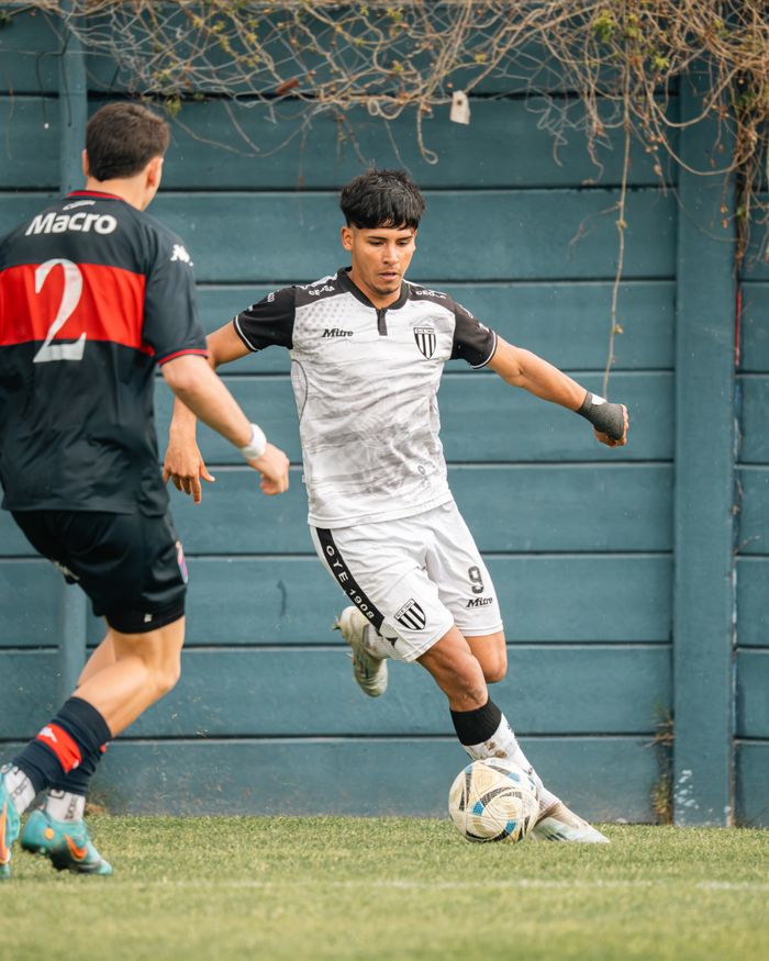Dynamic soccer game featuring players in action, showcasing athletic skill and teamwork on the field.